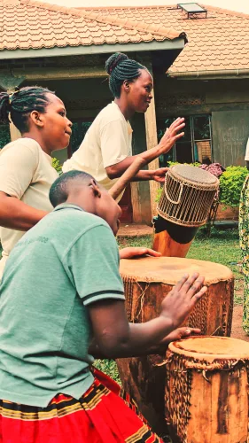 A local community in the neighborhood of Bwindi entertaining guests