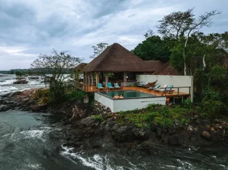 Tourists in a plunge pool at Wildwaters lodge Tourists in a plunge pool at Wildwaters lodge